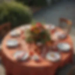 Elegant circular outdoor table setting adorned with a vibrant tablecloth.