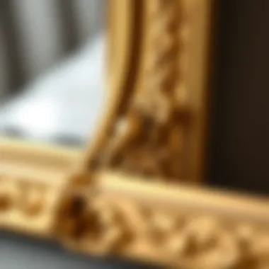 Close-up of intricate details on a gold mirror frame